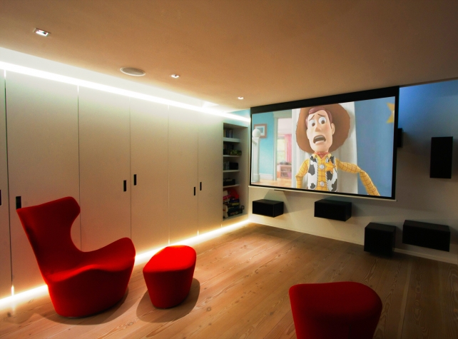 A JVC X-30 projector delivers crisp images on this hidden motorised 2.5m metre screen